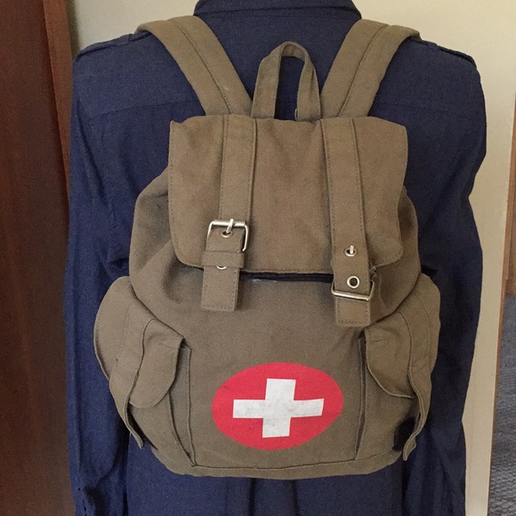 backpack with a red cross
